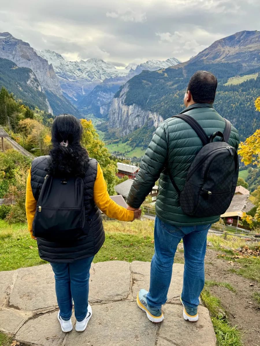 The two founders of Big Guy Small Batch, photographed from behind at a mountain viewpoint